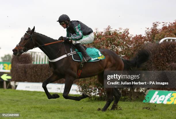 Altior ridden by Nico de Boinville clear an early fence before going on to win The bet 365 Celebration Chase Race run during bet365 Jump Finale day...