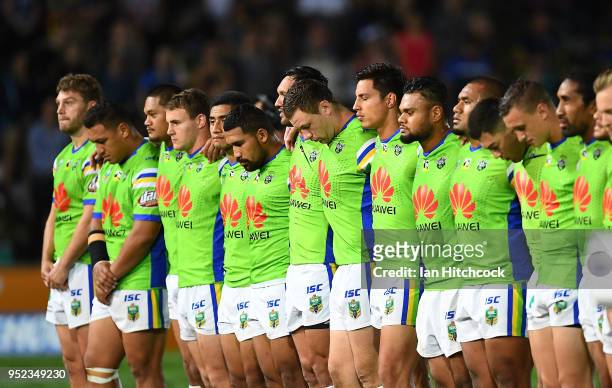 The Raiders stand together for the National Anthem before the start of the round eight NRL match between the North Queensland Cowboys and the...