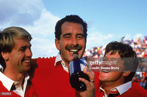 Paul Way, Sam Torrance and Ian Woosnam of the European team crack open the champagne to celebrate victory over the USA in the Ryder Cup at the Belfry...