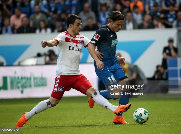 Filip Kostic of Hamburg and Nico Schulz of Hoffenheim battle for the ball during the Bundesliga match between TSG 1899 Hoffenheim and Hamburger SV at...