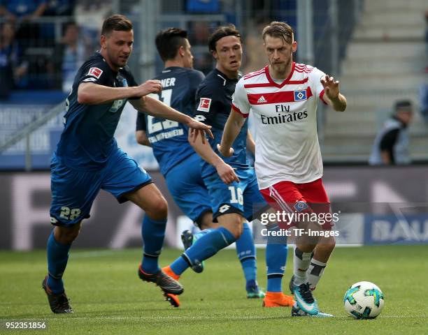 Adam Szalai of Hoffenheim and Aaron Hunt of Hamburg battle for the ball during the Bundesliga match between TSG 1899 Hoffenheim and Hamburger SV at...