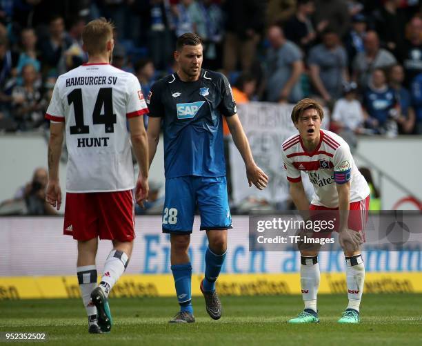 Aaron Hunt of Hamburg, Adam Szalai of Hoffenheim and Gotoku Sakai of Hamburg look on during the Bundesliga match between TSG 1899 Hoffenheim and...