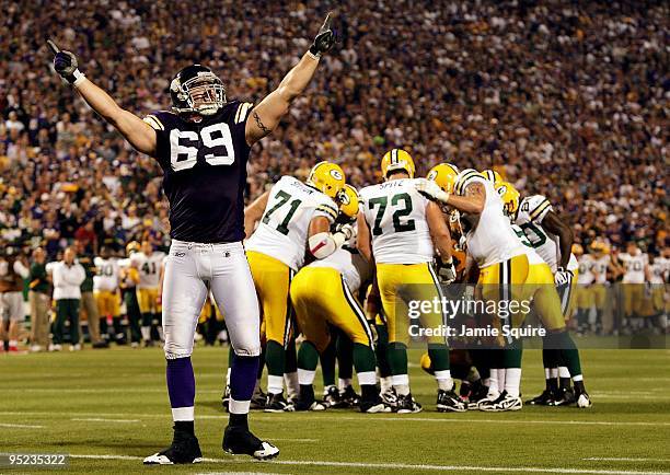 Defensive end Jared Allen of the Minnesota Vikings pumps up the crowd during the Monday Night Football game against the Green Bay Packers on October...