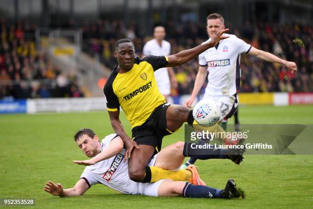 Jon Flanagan of Bolton Wanderers and Lucas Akins of Burton Albion battle for the ball during the Sky Bet Championship match between Burton Albion and...