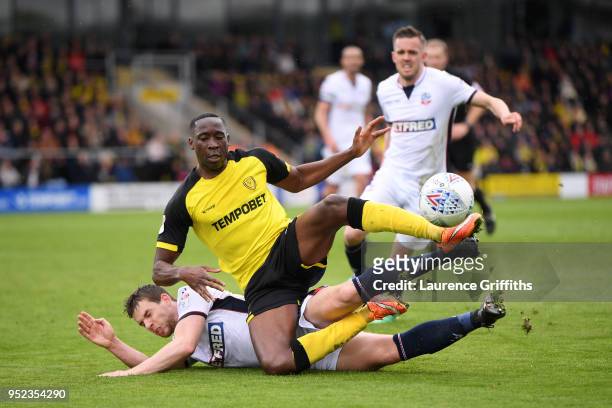 Jon Flanagan of Bolton Wanderers and Lucas Akins of Burton Albion clash during the Sky Bet Championship match between Burton Albion and Bolton...