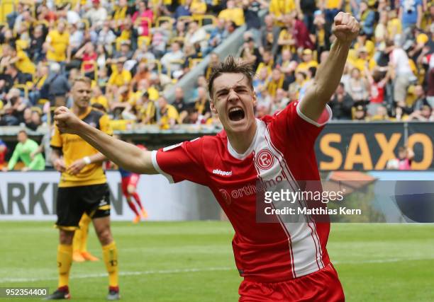 Florian Neuhaus of Duesseldorf jubilates and moves up into the Bundesliga after the Second Bundesliga match between SG Dynamo Dresden and Fortuna...