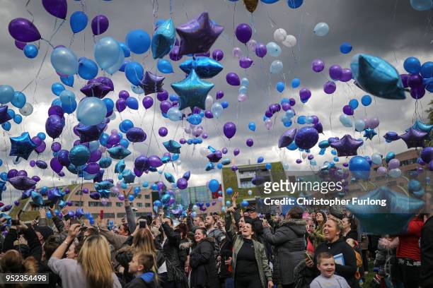 People react as balloons are released in memory of Alfie Evans outside Alder Hey Hospital after the terminally ill 23-month-old died at 2:30am this...