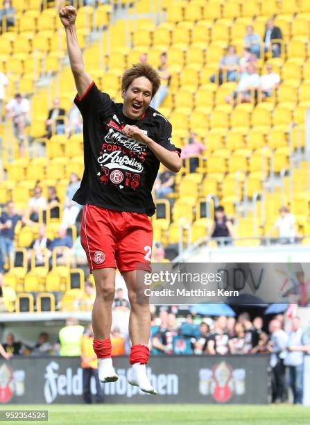 Genki Haraguchi of Duesseldorf jubilates after moving up into the Bundesliga after the Second Bundesliga match between SG Dynamo Dresden and Fortuna...