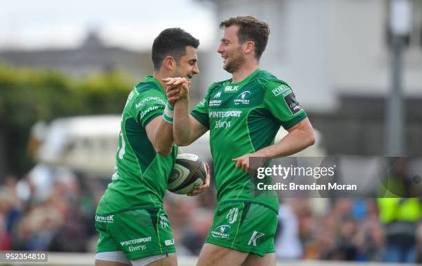 Galway , Ireland - 28 April 2018; Tiernan O'Halloran of Connacht celebrates with team-mate Jack Carty, right, after scoring their side's second try...