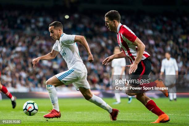Lucas Vazquez of Real Madrid is followed by Oscar de Marcos Arana of Athletic Club de Bilbao during the La Liga match between Real Madrid and...