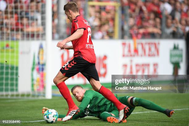 Nils Petersen of Freiburg scores a goal past goalkeeper Timo Horn of Koeln to make it 2:0 during the Bundesliga match between Sport-Club Freiburg and...