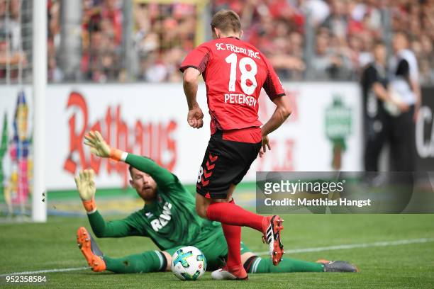 Nils Petersen of Freiburg scores a goal past goalkeeper Timo Horn of Koeln to make it 2:0 during the Bundesliga match between Sport-Club Freiburg and...