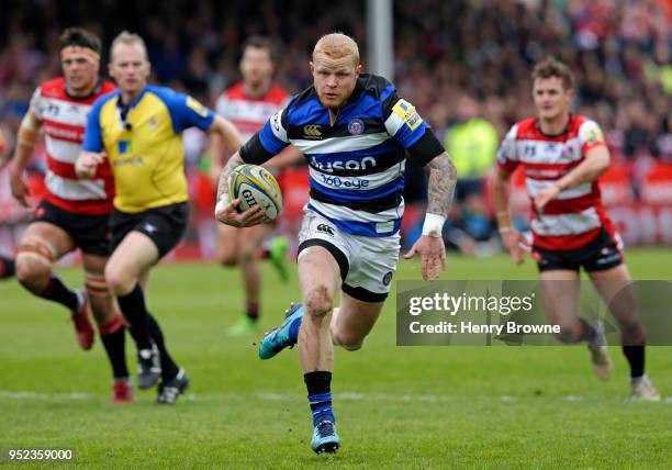 Tom Homer of Bath runs in to score their fourth try during the Aviva Premiership match between Gloucester Rugby and Bath Rugby at Kingsholm Stadium...