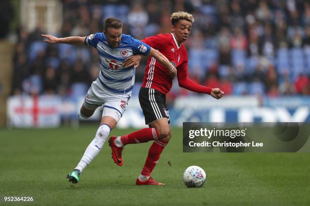 Chris Gunter of Reading battles with Ben Folami of Ipswich during the Sky Bet Championship match between Reading and Ipswich Town at Madejski Stadium...
