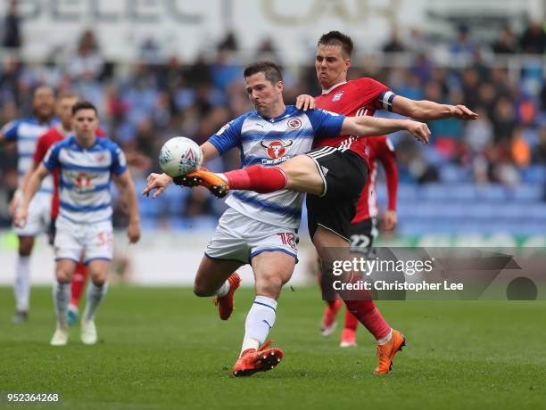 Jonas Knudsen of Ipswich steels the ball from Yann Kermorgant of Reading during the Sky Bet Championship match between Reading and Ipswich Town at...