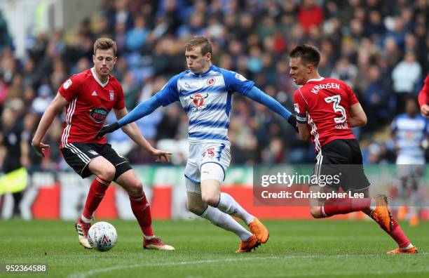 Jon Dadi Bodvarsson of Reading battles with Adam webster and Jonas Knudsen of Ipswich during the Sky Bet Championship match between Reading and...