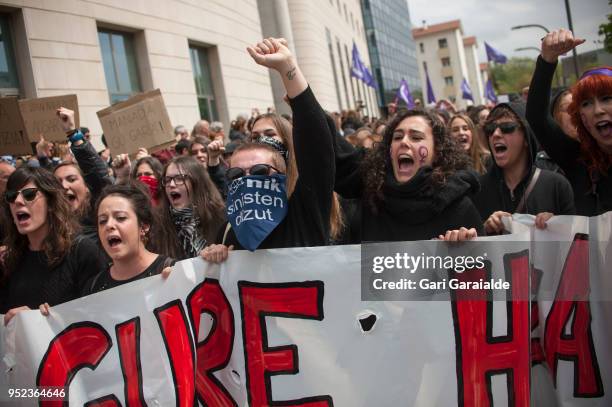 People shout slogans and hold banners during a demonstration against the verdict of the 'La Manada' gang case on April 27, 2018 in Pamplona, Spain....