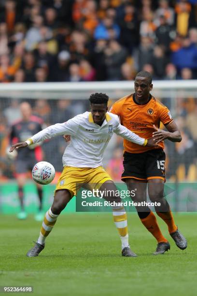 Lucas João of Sheffield Wednesday is challenged by Willy Boly of Wolverhampton Wanderers during the Sky Bet Championship match between Wolverhampton...