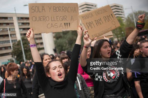 People shout slogans and hold banners during a demonstration against the verdict of the 'La Manada' gang case on April 27, 2018 in Pamplona, Spain....