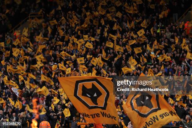 Wolverhampton Wanderers fans wave flags to show their support during the Sky Bet Championship match between Wolverhampton Wanderers and Sheffield...