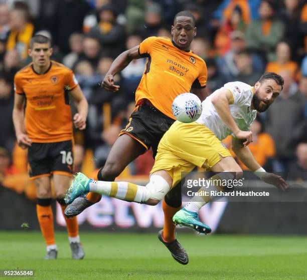 Atdhe Nuhiu of Sheffield Wednesday is challenged by Willy Boly of Wolverhampton Wanderers during the Sky Bet Championship match between Wolverhampton...