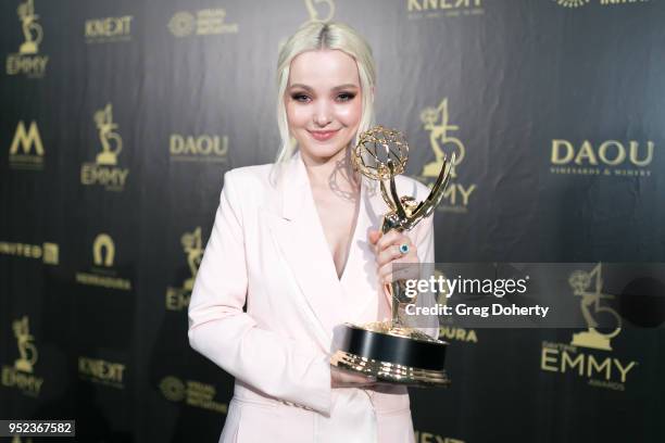 Dove Cameron displays her Emmy at the 2018 Daytime Creative Arts Emmy Awards at Pasadena Civic Center on April 27, 2018 in Pasadena, California.