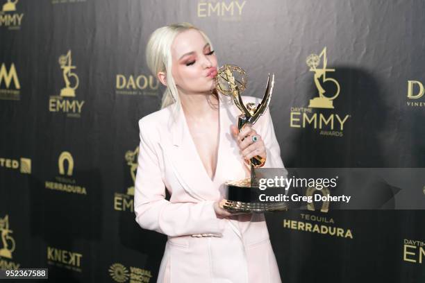 Dove Cameron displays her Emmy at the 2018 Daytime Creative Arts Emmy Awards at Pasadena Civic Center on April 27, 2018 in Pasadena, California.