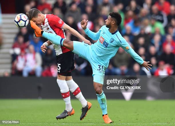 Southampton's Polish defender Jan Bednarek vies with Bournemouth's French midfielder Lys Mousset during the English Premier League football match...