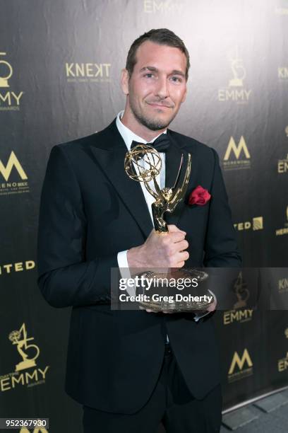 Brandon McMillan displays his Emmy at the 2018 Daytime Creative Arts Emmy Awards at Pasadena Civic Center on April 27, 2018 in Pasadena, California.