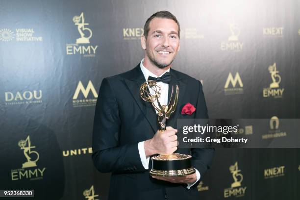Brandon McMillan displays his Emmy at the 2018 Daytime Creative Arts Emmy Awards at Pasadena Civic Center on April 27, 2018 in Pasadena, California.