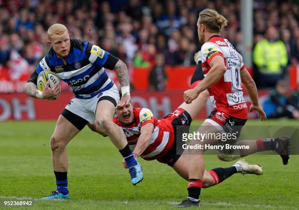 Tom Homer of Bath avoids Billy Burns of Gloucester and runs in their fourth try during the Aviva Premiership match between Gloucester Rugby and Bath...