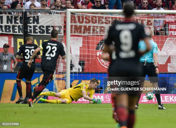 Frankfurt's Finnish goalkeeper Lukas Hradecky fails to save the 2-0 shot by Bayern Munich's forward Sandro Wagner during the German first division...