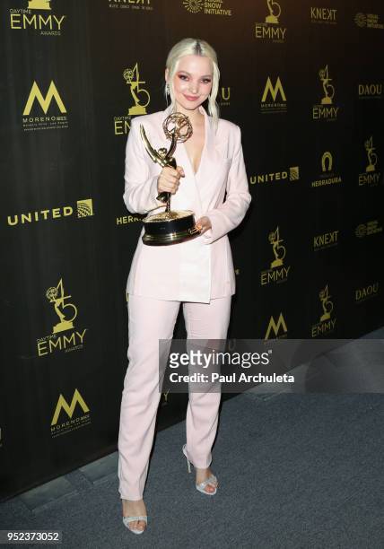 Actress Dove Cameron attends the press room at the 45th Annual Daytime Creative Arts Emmy Awards at the Pasadena Civic Auditorium on April 27, 2018...