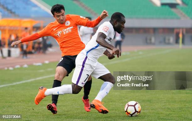 Frank Acheampong of Tianjin Teda and Nizamdin Ependi of Beijing Renhe in action during 2018 China Super League match between Beijing Renhe and...