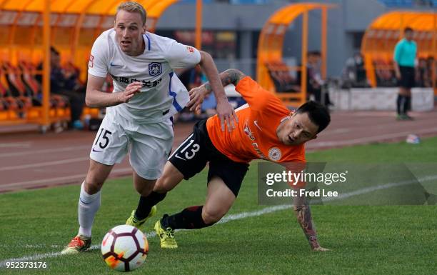 Felix Bastians of Tianjin Teda and Liang Shi of Beijing Renhe in action during 2018 China Super League match between Beijing Renhe and Tianjin Teda...