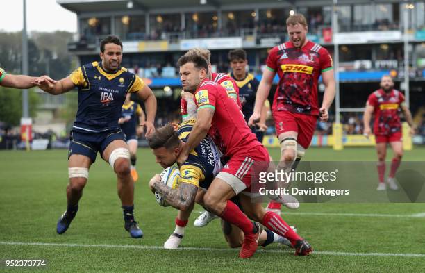Francois Hougaard of Worcester Warriors holds off Danny Care to score a try during the Aviva Premiership match between Worcester Warriors and...