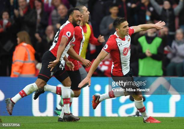Dusan Tadic of Southampton celebrates scoring his side's second goal with Nathan Redmond and Oriol Romeu during the Premier League match between...