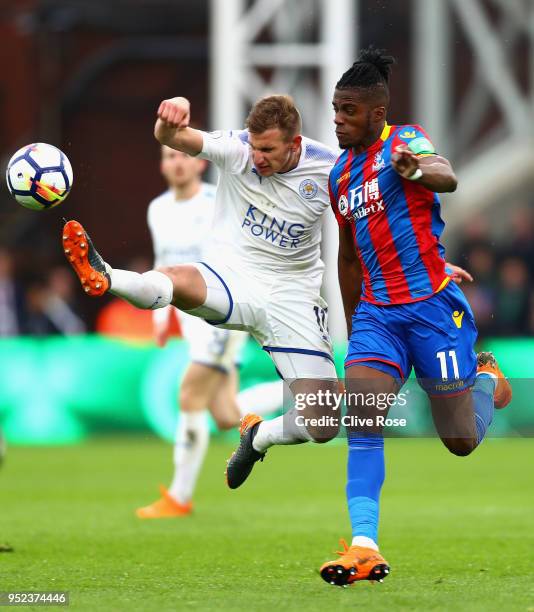 Wilfried Zaha of Crystal Palace and Marc Albrighton of Leicester City clash in the build up to the red card of Marc Albrighton during the Premier...