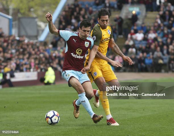 Burnley's Jack Cork battles with Brighton & Hove Albion's Leonardo Ulloa during the Premier League match between Burnley and Brighton and Hove Albion...