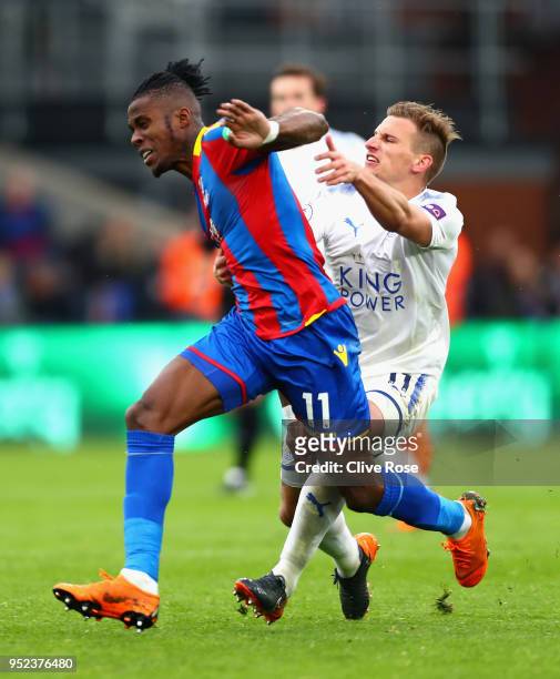 Wilfried Zaha of Crystal Palace and Marc Albrighton of Leicester City clash in the build up to the red card of Marc Albrighton during the Premier...