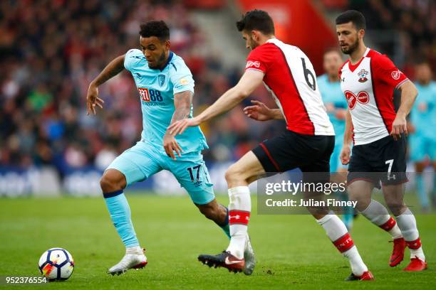 Wesley Hoedt of Southampton challenges Joshua King of AFC Bournemouth during the Premier League match between Southampton and AFC Bournemouth at St...