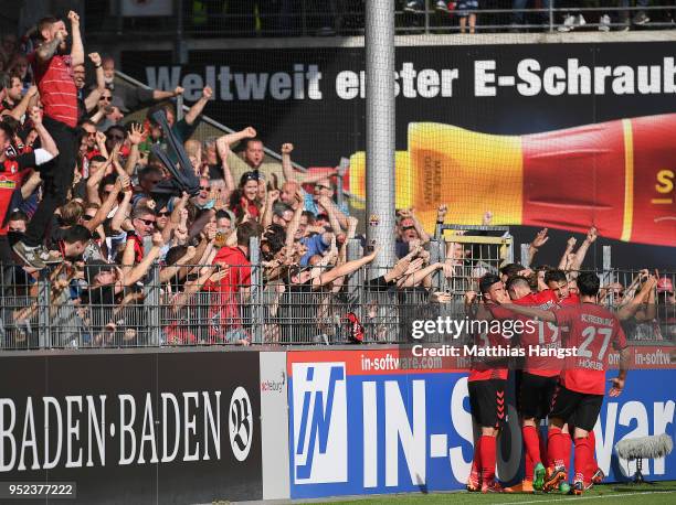 Lucas Hoeler of Freiburg is celebrated by his team after he scored a goal to make it 3:2 during the Bundesliga match between Sport-Club Freiburg and...