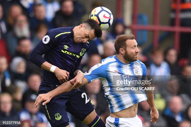 Everton's Argentinian defender Ramiro Funes Mori wins a header from Huddersfield Town's Belgian striker Laurent Depoitre during the English Premier...