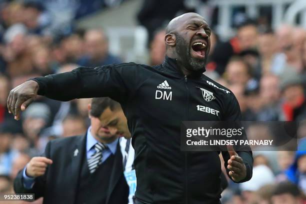West Bromwich Albion's caretaker manager Darren Moore gestures on the touchline during the English Premier League football match between Newcastle...