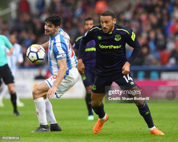 Cenk Tosun of Everton is challenged by Christopher Schindler of Huddersfield Town during the Premier League match between Huddersfield Town and...