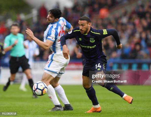 Cenk Tosun of Everton is challenged by Christopher Schindler of Huddersfield Town during the Premier League match between Huddersfield Town and...
