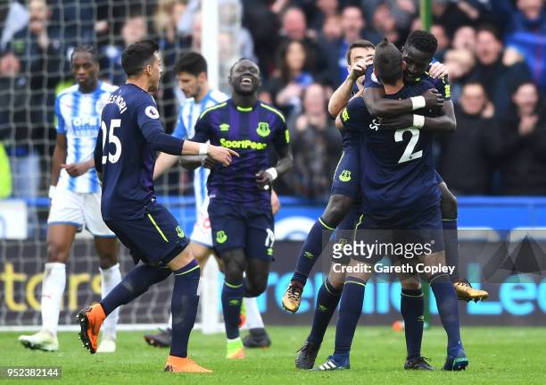 Idrissa Gueye of Everton celebrates scoring his side's second goal with team mates whilst embracing Morgan Schneiderlin during the Premier League...
