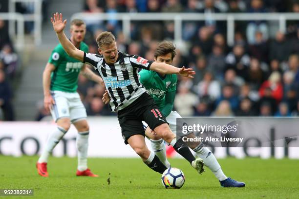 Matt Ritchie of Newcastle United and Grzegorz Krychowiak of West Bromwich Albion battle for possession during the Premier League match between...