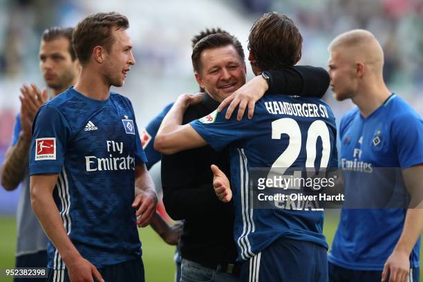 Head coach Christian Titz and Albin Ekdal of Hamburg celebrate after the Bundesliga match between VfL Wolfsburg and Hamburger SV at Volkswagen Arena...