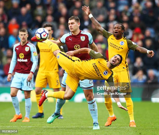 Biram Kayal of Brighton and Hove Albion is challenged Sam Vokes of Burnley during the Premier League match between Burnley and Brighton and Hove...